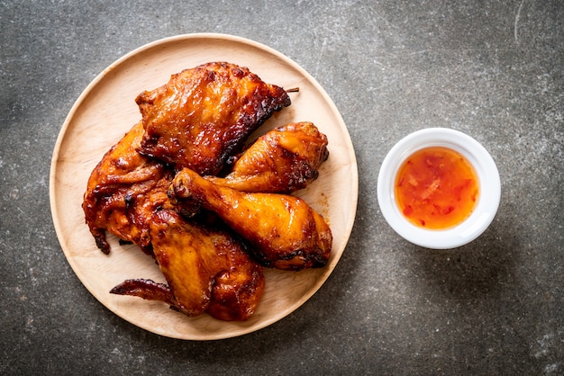 grilled and barbecue chicken on table