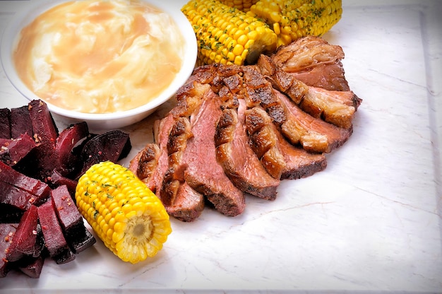 Grilled Beef or Picanha on the white marble board Top view