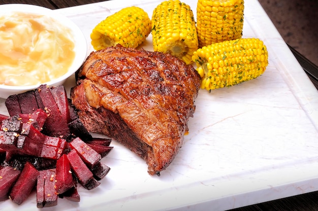 Grilled Beef or Picanha on the white marble board Top view