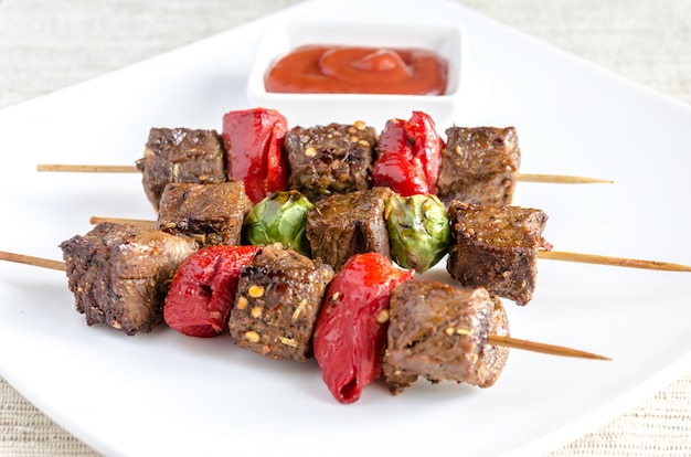 Grilled beef skewers with pepper and brussels