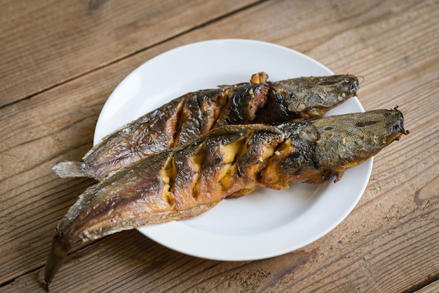 Grilled catfish on white plate Thailand food cooking catfish freshwater fish