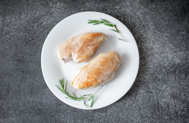 grilled chicken fillet on stone background