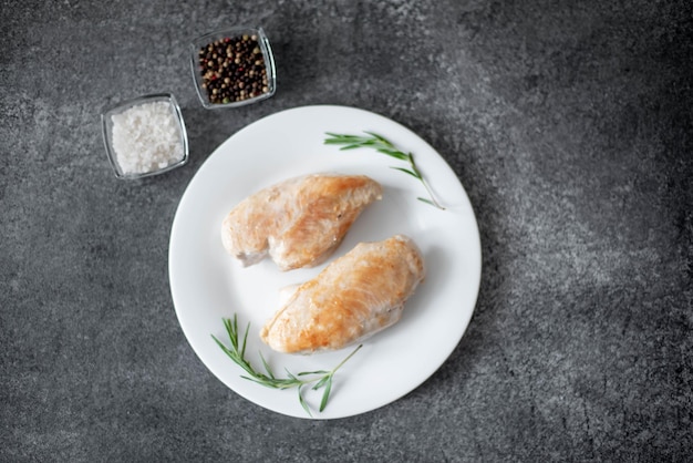 grilled chicken fillet on stone background