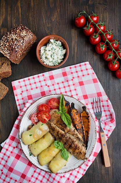 Grilled chicken fillet with baked vegetables. Baked dish. Balanced diet.