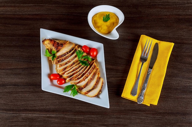 Grilled chicken fillet on wooden cutting board chicken breast cut