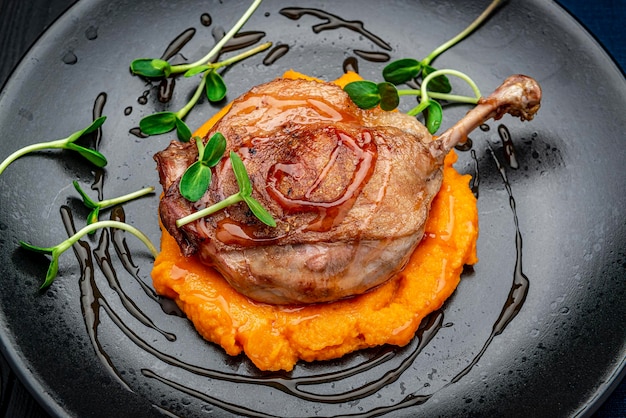 Grilled chicken leg with pumpkin puree