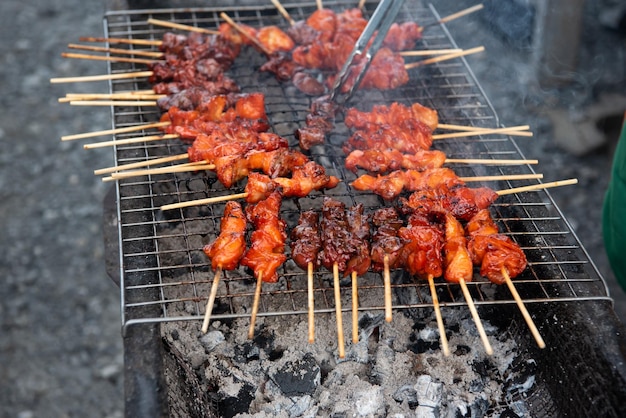 Grilled chicken sauce at Thai street food market