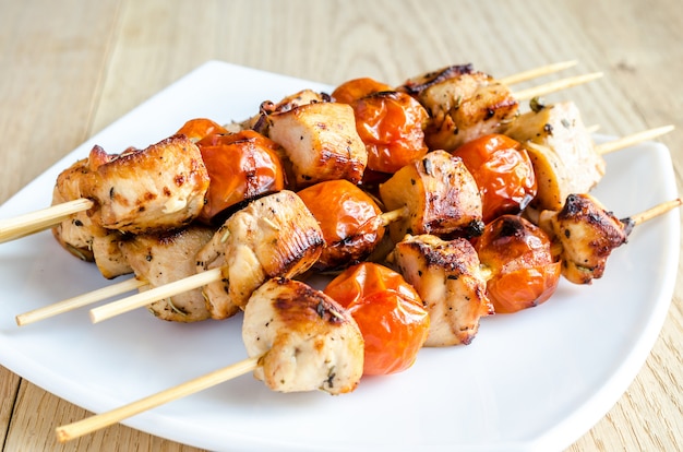 Grilled chicken skewers with cherry tomatoes