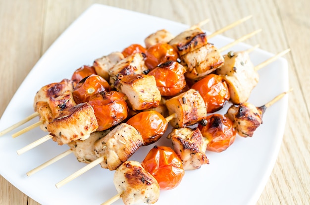 Grilled chicken skewers with cherry tomatoes