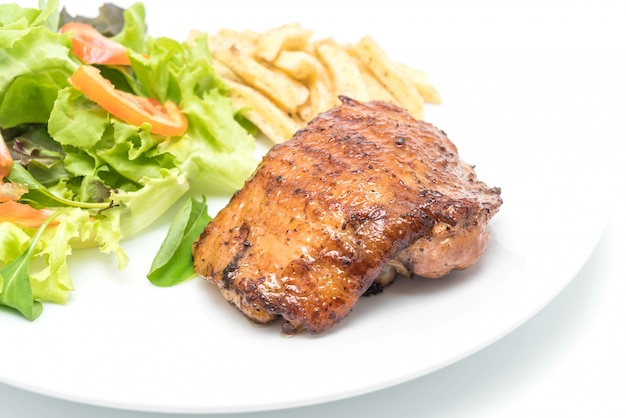 grilled chicken steak with french fries and vegetable salad