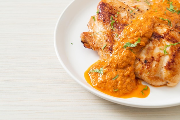 grilled chicken steak with red curry sauce