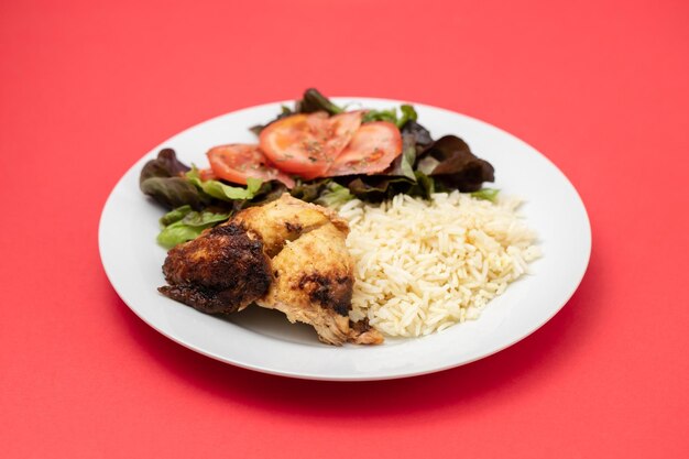 Grilled chicken with boiled rice and fresh salad