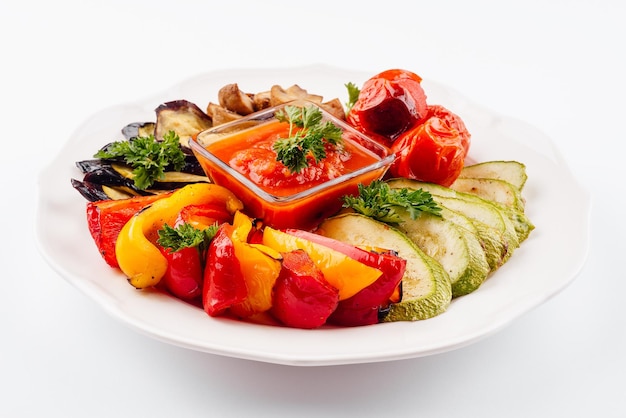 Grilled colorful vegetables on white plate