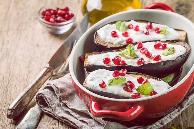 Grilled eggplants with garlic yogurt sauce and pomegranate