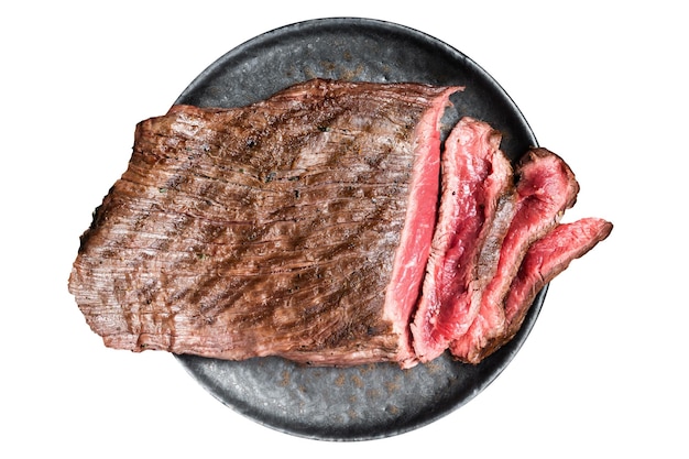 Grilled Flap or Flank Steak sliced on a plate Isolated on white background