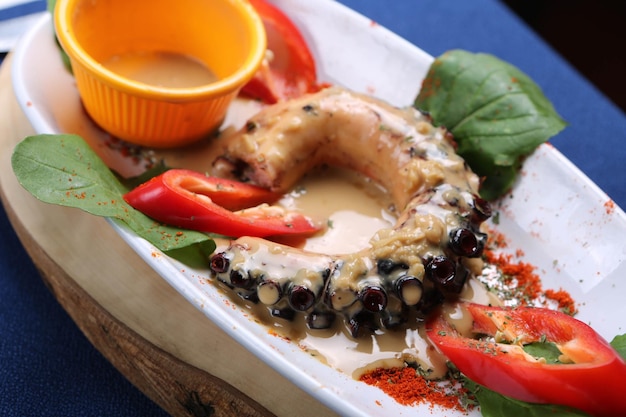 Grilled Galician octopus leg with sauce