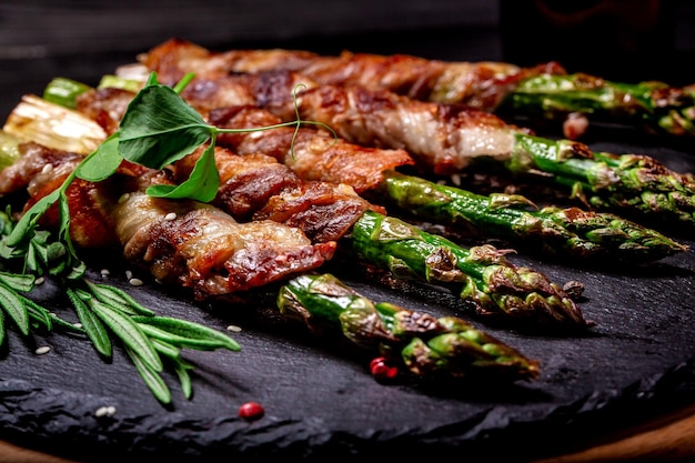 Grilled green asparagus wrapped with bacon Ketogenic diet Healthy food diet menu Top view overhead banner