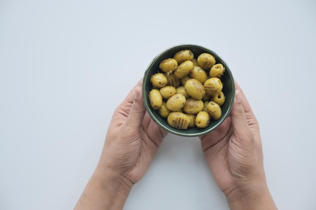 Grilled green olives in a bowl