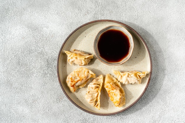 Grilled Gyoza or jiaozi fried stuffed dumplings negative space