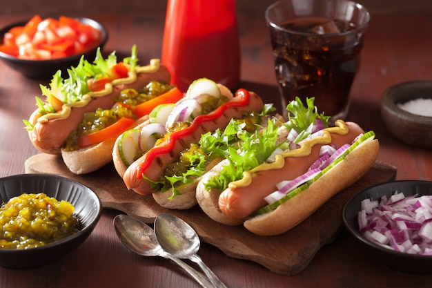 Grilled hot dogs with vegetables ketchup mustard