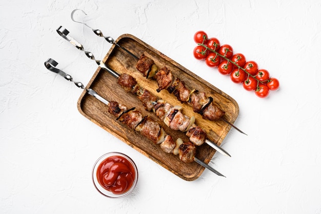 Photo grilled kebab set, on white stone table background, top view flat lay, with copy space for text