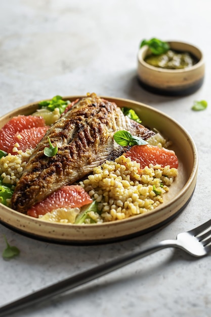 Grilled mackerel with citrus bulgur and pesto