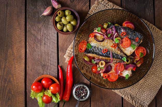 Grilled mackerel with vegetables in Mediterranean style. Top view