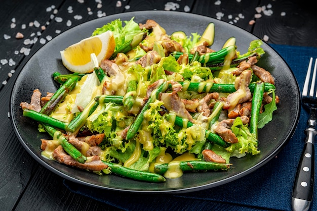 Grilled meat salad with green beans and mustard sauce