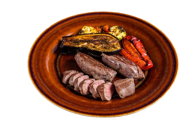 Grilled mutton tenderloin Fillet Meat lamb sirloin on rustic plate with vegetables Isolated on white background