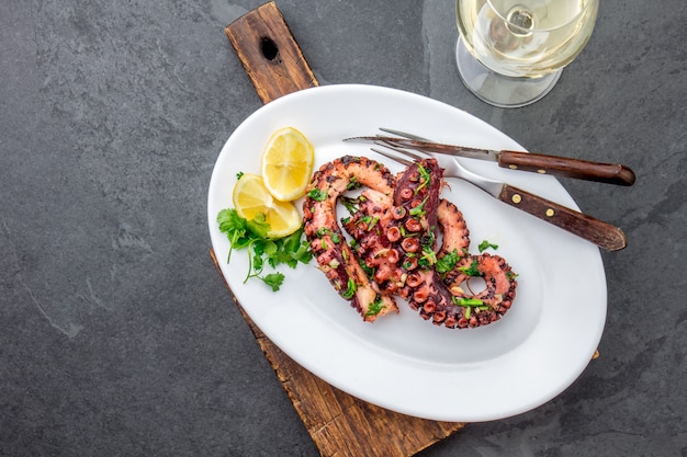 Grilled octopus on a white plate