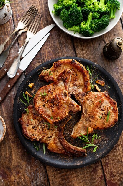 Grilled or pan fried pork chops on the bone