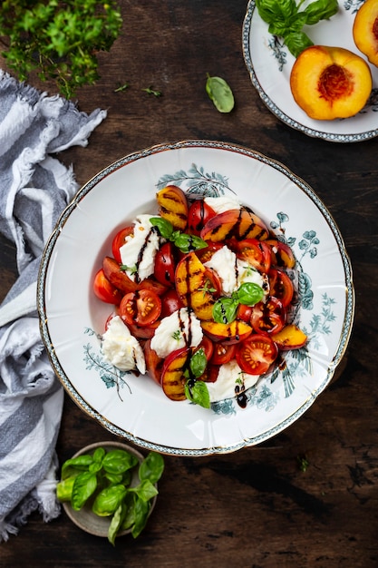 Grilled peach Caprese salad with mozzarella and tomatoes