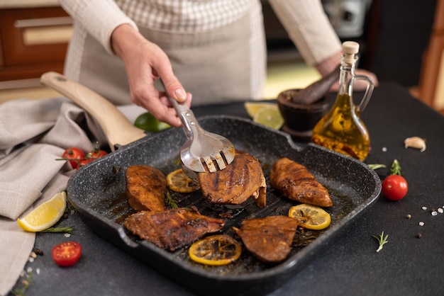 Grilled pieces of organic tuna steak on a grill frying pan