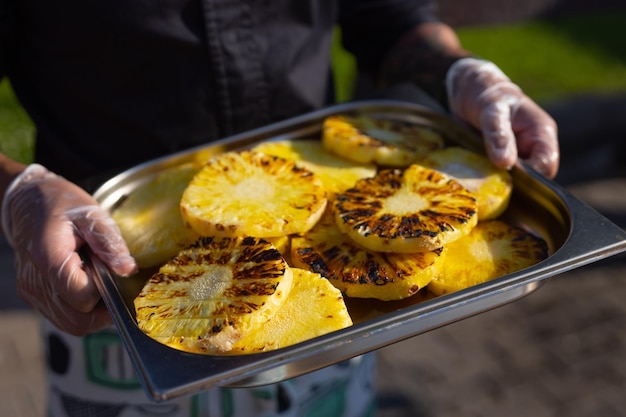 grilled pineapple wedges on a tray