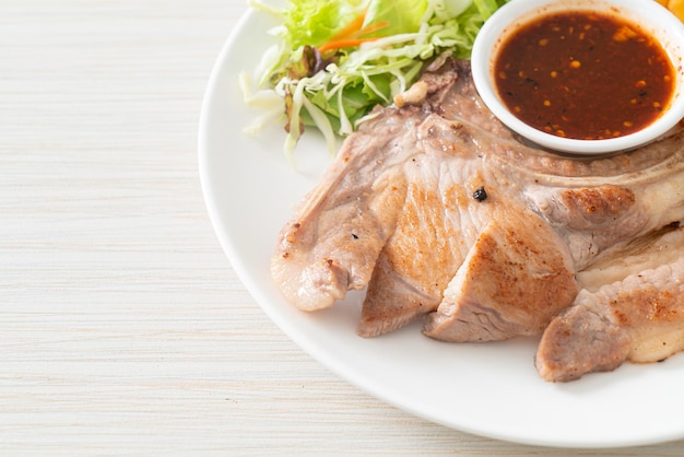 Grilled pork chop steak with Thai spicy dipping sauce