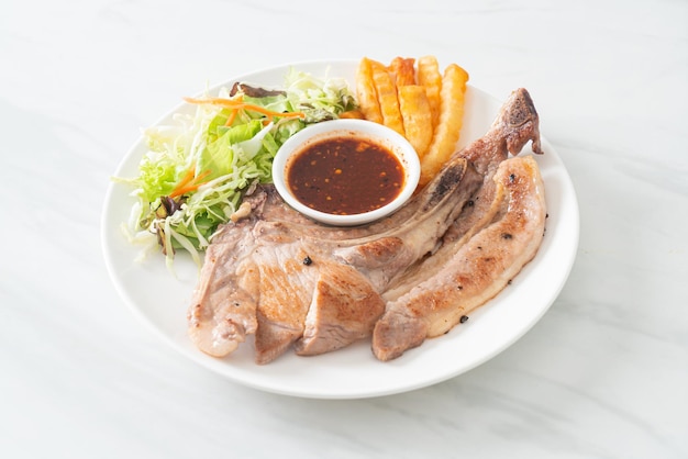 Grilled pork chop steak with Thai spicy dipping sauce