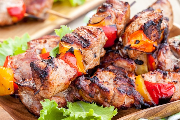 Grilled pork kebab with red and yellow pepper