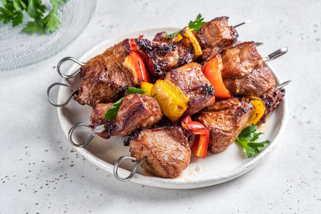 Grilled pork kebab with red and yellow pepper