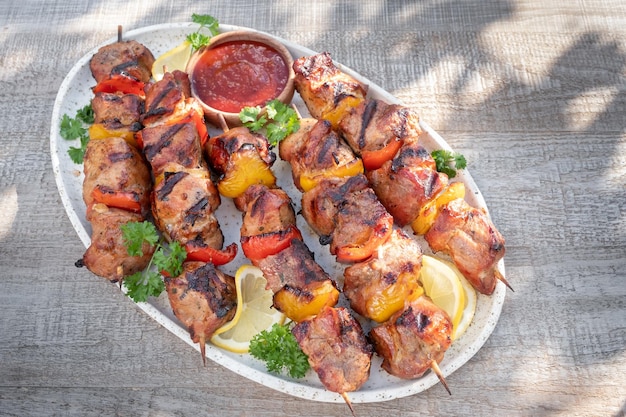 Grilled pork kebab with red and yellow pepper