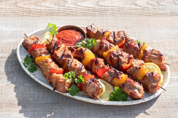 Grilled pork kebab with red and yellow pepper