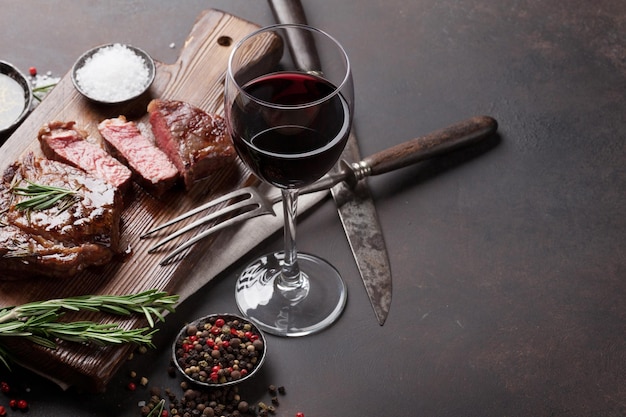 Grilled ribeye beef steak with red wine herbs and spices