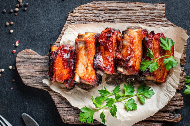 grilled ribs BBQ pork in spices and tomato sauce piece of meat second course snack ready to eat