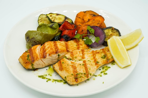 Grilled salmon accompanied by roasted vegetables