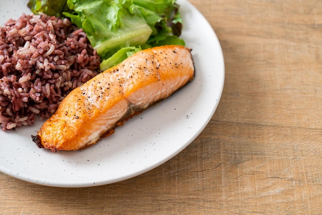 grilled salmon fillet steak with rice berry and vegetable - healthy food style