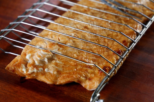 Grilled salmon on the grill with grill marks On wooden background