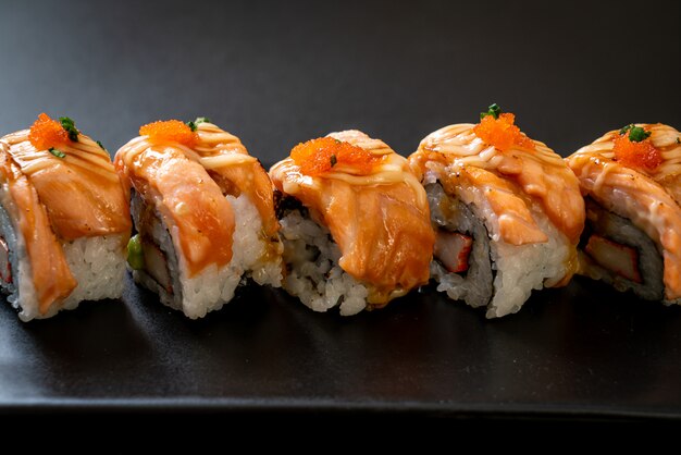 grilled salmon sushi roll with sauce