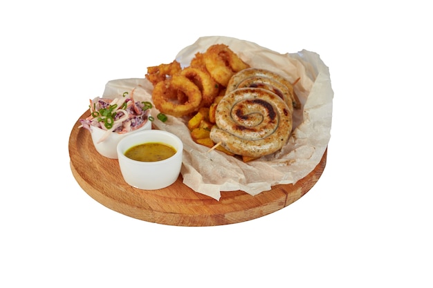 Grilled sausage with potatoes fries and bell peppers, ketchup, on white plate, isolated on white