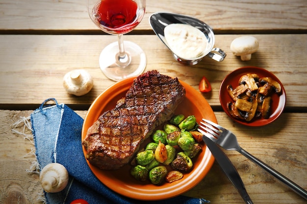 Grilled steak with vegetables closeup