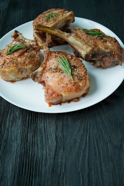 Grilled steaks of pork ribs with spices and herbs.