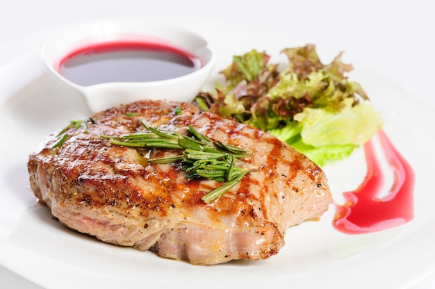 Grilled steaks and vegetable salad